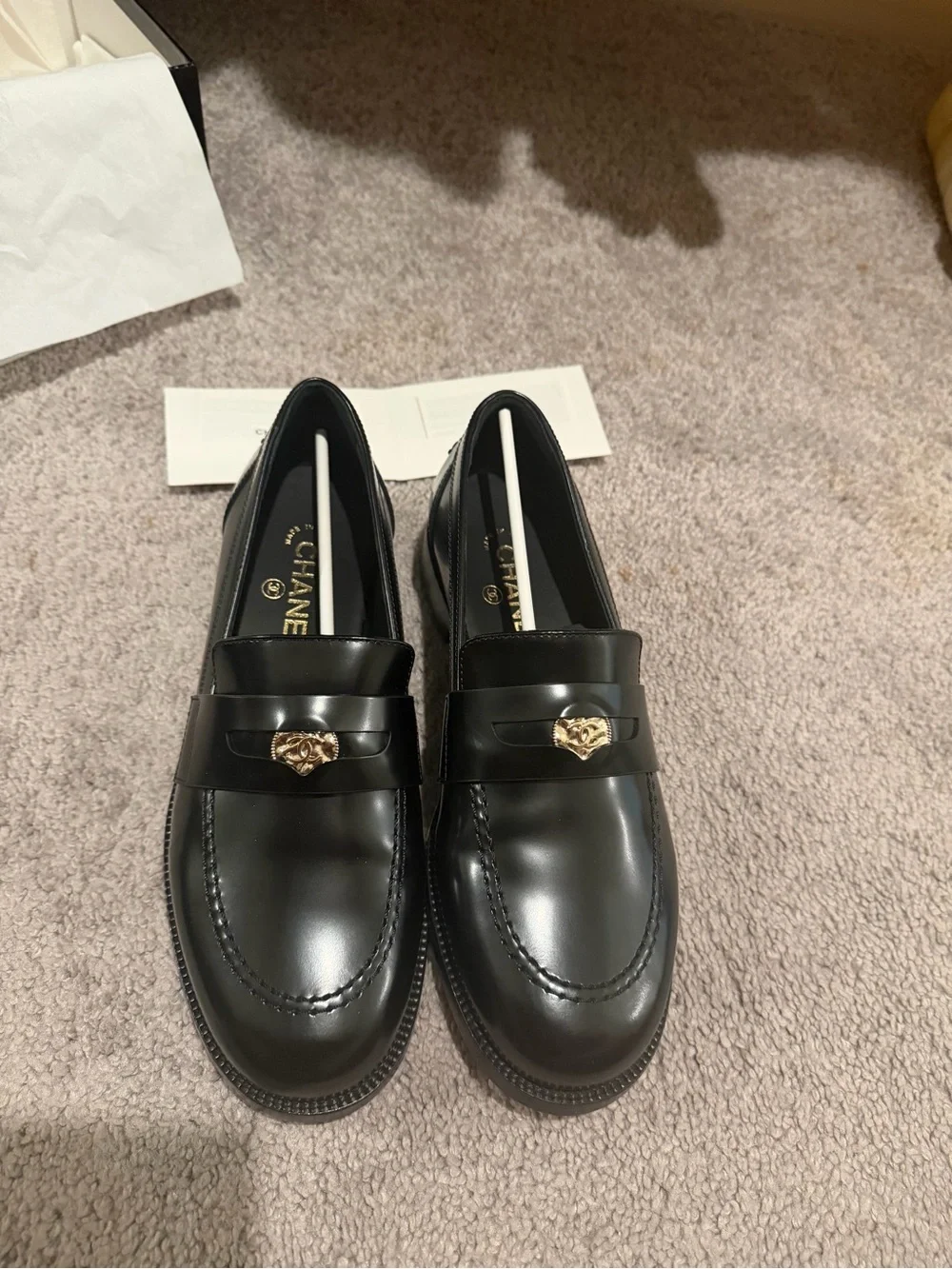 CHANEL Black Leather Loafers with Gold Heart Accent